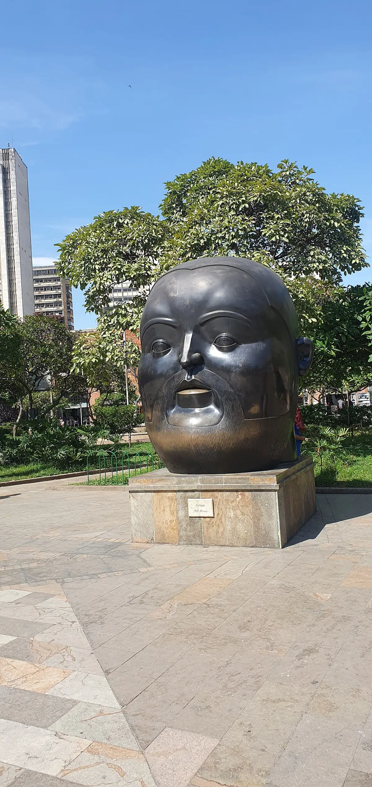 Bronze sculpture of a head in Plaza Botero